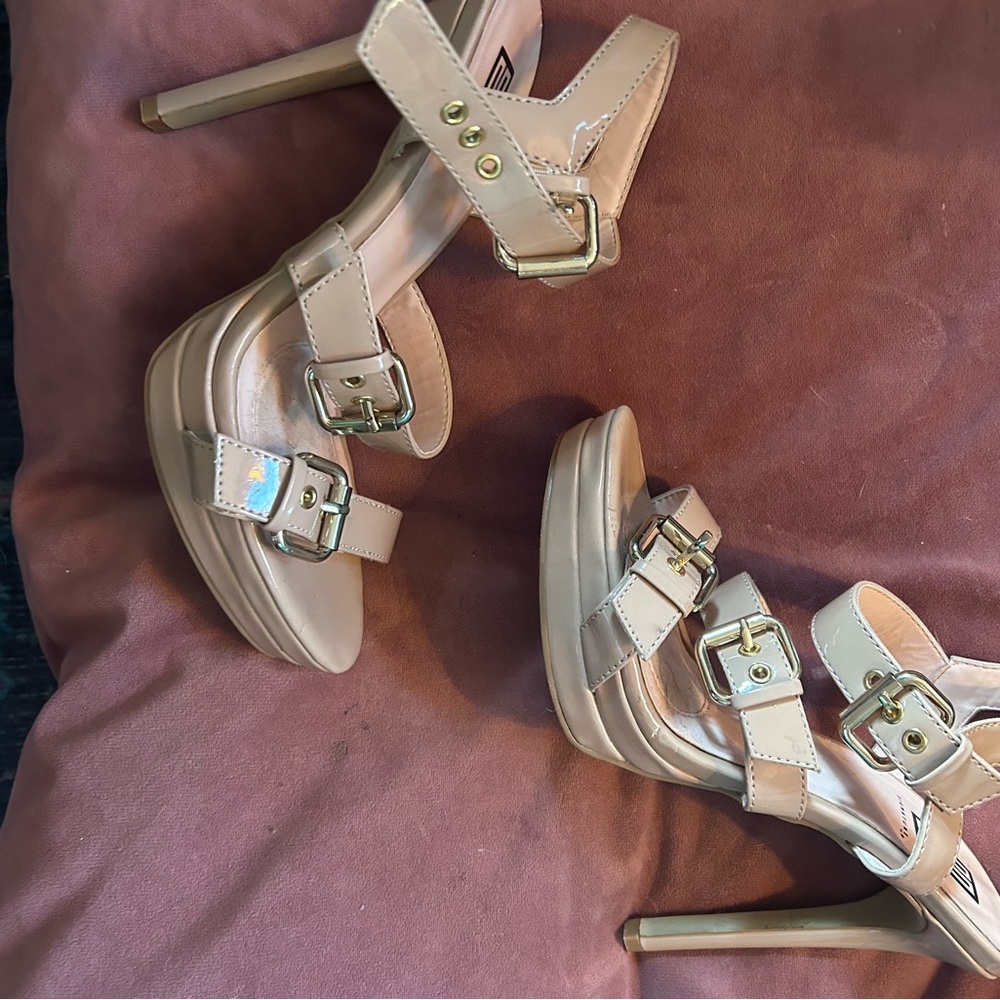 Nude heels gold buckles
